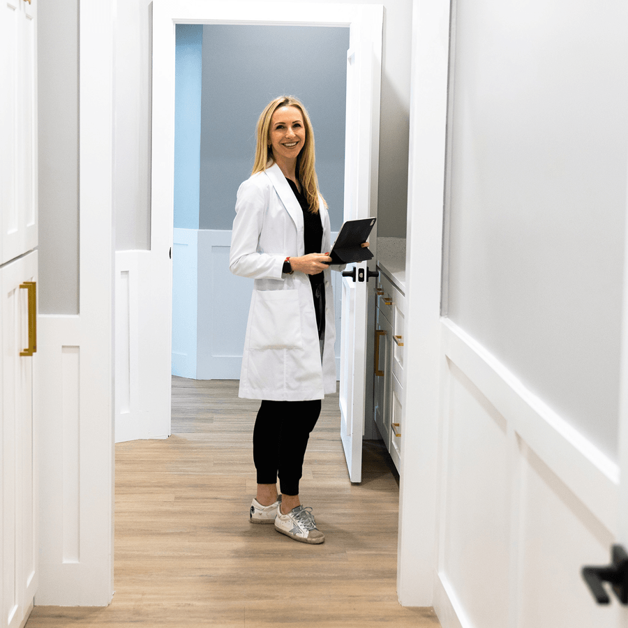 Healthcare provider walking through the Make You Well clinic, representing our commitment to accessible patient care.
