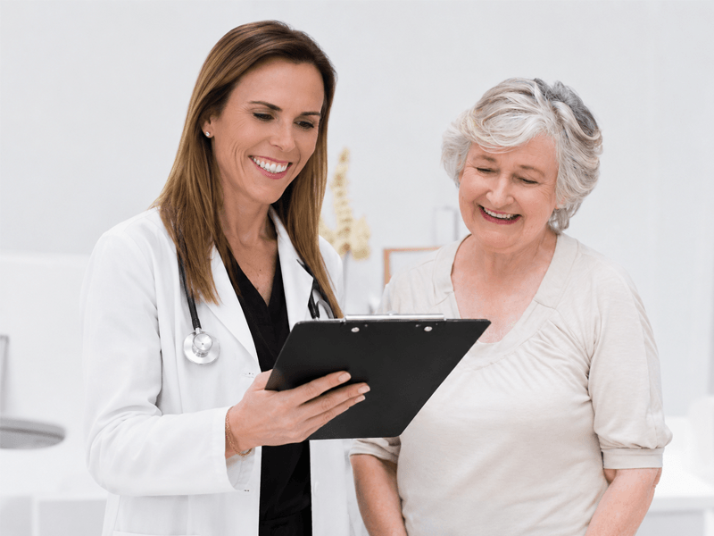 Make You Well provider offering compassionate patient care and consultation during a routine visit.