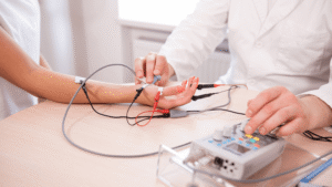 Patient undergoing EMG and nerve conduction testing to diagnose numbness, weakness, and nerve pain